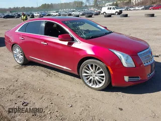 2013 Cadillac XTS Platinum with VIN 2G61V5S37D9176133, listed as a IAAI auction lot 41497048 with 99,476 mi miles. Bid and sale history available at carsss.com. Image 1.
