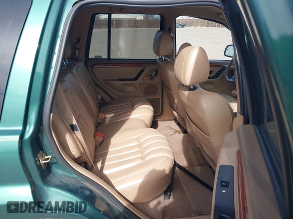 1999 Jeep Grand Cherokee Limited with VIN 1J4GW68N4XC544651, listed as a IAAI auction lot 41742346 with 94,904 mi miles and . Bid and sale history available at DreamBid. Image 8.