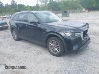2024 Mazda CX-90 Preferred z VIN JM3KKBHD6R1118705, wystawiony jako IAAI lot #42135120 z przebiegiem 23 347 mil mil oraz . Historia ofert i sprzedaży dostępna na DreamBid. Obrazek 1.