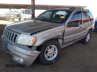 2000 Jeep Grand Cherokee Limited z VIN 1J4GW58N1YC206992, wystawiony jako IAAI lot #42057236 z przebiegiem 183 986 mil mil oraz . Historia ofert i sprzedaży dostępna na DreamBid. Obrazek 6.