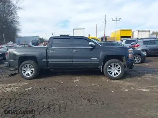 2015 Chevrolet Silverado 1500 High Country with VIN 3GCUKTEC3FG506216, listed as a IAAI auction lot 41672433 with 77,653 mi miles. Bid and sale history available at carsss.com. Image 13.