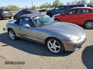 2003 Mazda MX-5 Miata Cloth with VIN JM1NB353430308653, listed as a Copart auction lot 53129865 with 144,549 mi miles and Salvage Title. Bid and sale history available at DreamBid. Image 4.