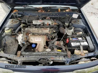 1989 Toyota Camry z VIN JT2SV21E6K3335385, wystawiony jako Copart lot #82466934 z przebiegiem 74 815 mil mil oraz Czysty tytuł • Clean title. Historia ofert i sprzedaży dostępna na DreamBid. Obrazek 11.