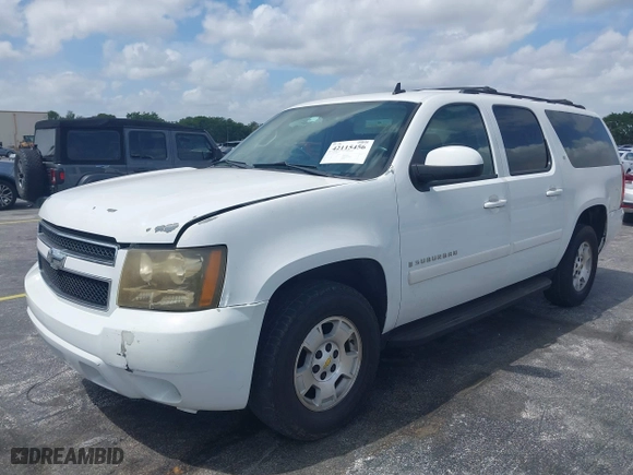 2009 Chevrolet Suburban LT w/2LT with VIN 1GNFC26JX9J108623, listed as a IAAI auction lot 42115456 with 144,370 mi miles. Bid and sale history available at carsss.com. Image 2.