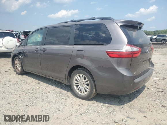 2015 Toyota Sienna XLE with VIN 5TDYK3DC6FS576670, listed as a Copart auction lot 62612345 with 106,475 mi miles and Salvage title. Bid and sale history available at DreamBid. Image 2.
