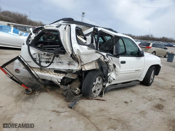 2003 GMC Envoy SLE with VIN 1GKDS13SX32259798, listed as a Copart auction lot 48712015 with 100,330 mi miles and Salvage Title. Bid and sale history available at carsss.com. Image 3.