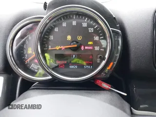 2019 MINI Countryman Cooper S z VIN WMZYT5C57K3G91854, wystawiony jako IAAI lot #41394154 z przebiegiem 68 629 mil mil oraz . Historia ofert i sprzedaży dostępna na DreamBid. Obrazek 15.