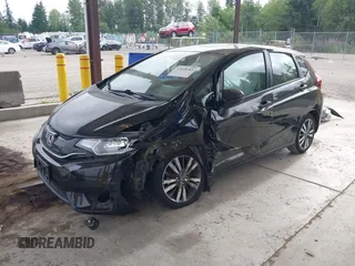 2015 Honda Fit EX-L z VIN 3HGGK5H81FM701122, wystawiony jako IAAI lot #42610165 z przebiegiem 74 969 mil mil oraz . Historia ofert i sprzedaży dostępna na DreamBid. Obrazek 2.