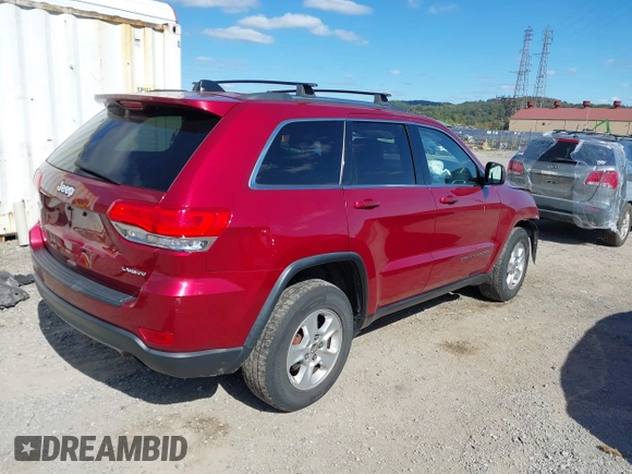 2014 Jeep Grand Cherokee Laredo with VIN 1C4RJFAG8EC262292, listed as a IAAI auction lot 40568162 with 124,871 mi miles and . Bid and sale history available at DreamBid. Image 4.