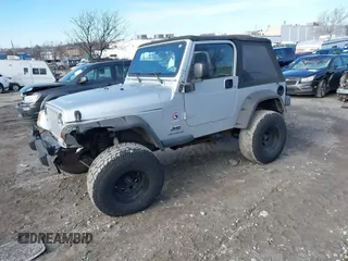 2003 Jeep Wrangler X with VIN 1J4FA39S33P363153, listed as a IAAI auction lot 41584805 with 160,676 mi miles. Bid and sale history available at carsss.com. Image 23.