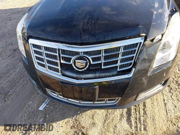 2013 Cadillac XTS z VIN 2G61N5S32D9238652, wystawiony jako IAAI lot #40966692 z przebiegiem 90 834 mil mil oraz . Historia ofert i sprzedaży dostępna na DreamBid. Obrazek 6.