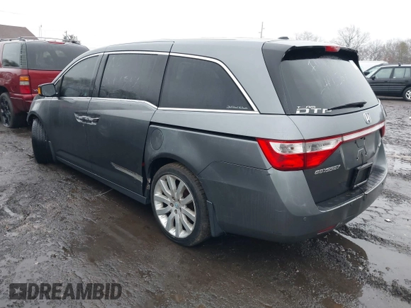 2012 Honda Odyssey Touring with VIN 5FNRL5H98CB089871, listed as a IAAI auction lot 41351447 with 999,999 mi miles. Bid and sale history available at carsss.com. Image 3.