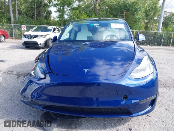 2025 Tesla Model Y Long Range z VIN 7SAYGDED0SF256650, wystawiony jako IAAI lot #41993206 z przebiegiem Nie podano mil oraz . Historia ofert i sprzedaży dostępna na DreamBid. Obrazek 12.