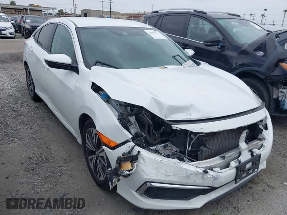 2020 Honda Civic LX with VIN 2HGFC2F64LH593100, listed as a IAAI auction lot 41877572 with 76,713 mi miles and . Bid and sale history available at DreamBid. Image 1.