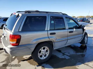1999 Jeep Grand Cherokee Laredo with VIN 1J4GW58NXXC776438, listed as a Copart auction lot 84412044 with 163,060 mi miles and Salvage Title. Bid and sale history available at carsss.com. Image 3.