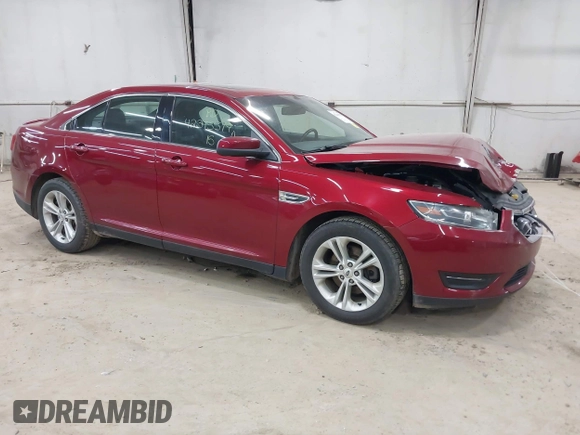 2015 Ford Taurus SEL z VIN 1FAHP2H88FG163179, wystawiony jako IAAI lot #42345579 z przebiegiem 142 424 mil mil oraz . Historia ofert i sprzedaży dostępna na DreamBid. Obrazek 1.