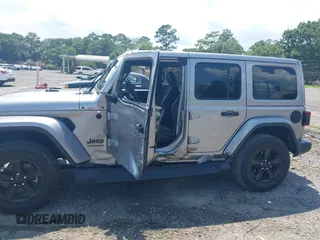 2021 Jeep Wrangler Unlimited Sahara with VIN 1C4HJXEN3MW628845, listed as a IAAI auction lot 42438049 with 49,970 mi miles and . Bid and sale history available at DreamBid. Image 14.