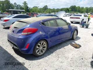 2012 Hyundai Veloster w/Gray Int with VIN KMHTC6AD7CU050444, listed as a IAAI auction lot 42170272 with 121,478 mi miles and . Bid and sale history available at DreamBid. Image 4.