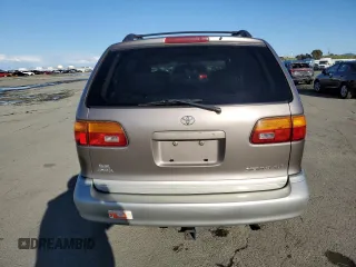 1999 Toyota Sienna LE with VIN 4T3ZF13C5XU144781, listed as a Copart auction lot 48932535 with 216,436 mi miles and Salvage Title. Bid and sale history available at carsss.com. Image 6.