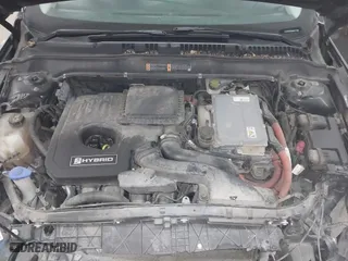2015 Ford Fusion Titanium Hybrid with VIN 3FA6P0RU2FR309074, listed as a IAAI auction lot 41240630 with 172,025 mi miles. Bid and sale history available at carsss.com. Image 10.