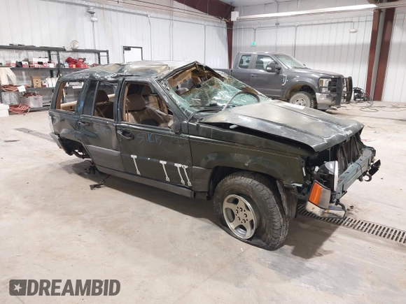 1997 Jeep Grand Cherokee Laredo z VIN 1J4GZ58YXVC729117, wystawiony jako IAAI lot #42244799 z przebiegiem Nie podano mil oraz . Historia ofert i sprzedaży dostępna na DreamBid. Obrazek 1.