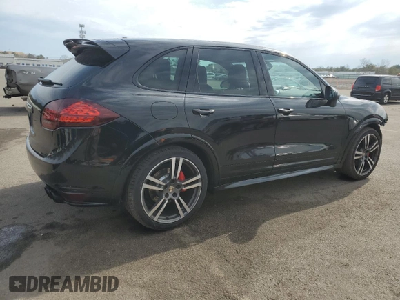 2013 Porsche Cayenne GTS с VIN WP1AD2A29DLA72323, выставлен на аукционе Copart как лот 52990885 с пробегом 100 812 миль миль и Списание • Salvage title. История ставок и продаж доступна на DreamBid. Изображение 3.