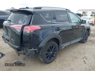 2018 Toyota RAV4 XLE with VIN 2T3RFREV1JW697044, listed as a IAAI auction lot 41891412 with 140,145 mi miles. Bid and sale history available at carsss.com. Image 4.