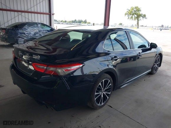 2018 Toyota Camry LE with VIN 4T1B11HK8JU575695, listed as a IAAI auction lot 41857828 with 180,413 mi miles. Bid and sale history available at carsss.com. Image 4.