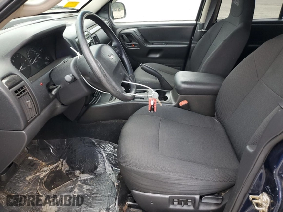2004 Jeep Grand Cherokee Laredo with VIN 1J4GW48S64C160831, listed as a Copart auction lot 61920005 with 135,243 mi miles and Clean title. Bid and sale history available at DreamBid. Image 7.