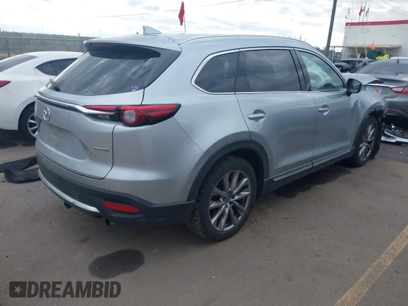 2021 Mazda CX-9 Grand Touring with VIN JM3TCBDY8M0515065, listed as a IAAI auction lot 41359765 with 80,221 mi miles and . Bid and sale history available at carsss.com. Image 4.