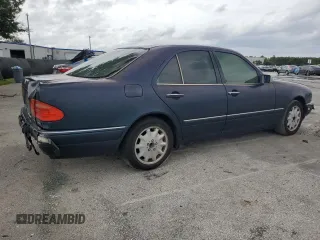 1997 Mercedes-Benz E-Class with VIN WDBJF55F4VJ025769, listed as a Copart auction lot 73460164 with 0 mi miles and Salvage Title. Bid and sale history available at carsss.com. Image 3.