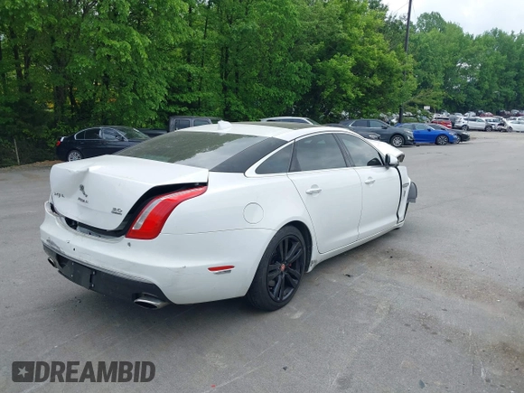 2016 Jaguar XJ Portfolio with VIN SAJWJ2GD8G8W00063, listed as a IAAI auction lot 42076707 with Not provided miles and . Bid and sale history available at DreamBid. Image 4.