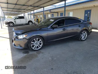 2014 Mazda 6 i Touring with VIN JM1GJ1V61E1146049, listed as a Copart auction lot 63472955 with Not provided miles and Salvage title. Bid and sale history available at DreamBid. Image 1.