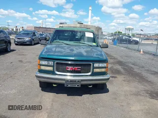 1997 GMC Suburban with VIN 1GKFK16R6VJ706590, listed as a IAAI auction lot 42194855 with 155,680 mi miles and . Bid and sale history available at DreamBid. Image 6.