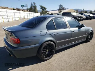 2000 BMW M5 z VIN WBSDE9349YBZ94615, wystawiony jako Copart lot #88802245 z przebiegiem 157 774 mil mil oraz Tytuł czysty. Historia ofert i sprzedaży dostępna na DreamBid. Obrazek 3.