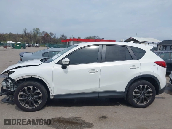2016 Mazda CX-5 Grand Touring with VIN JM3KE4DY6G0618121, listed as a IAAI auction lot 41958805 with 101,232 mi miles. Bid and sale history available at carsss.com. Image 15.