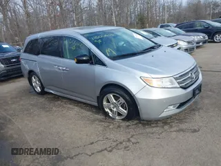 2013 Honda Odyssey Touring with VIN 5FNRL5H97DB021403, listed as a IAAI auction lot 41606606 with 223,547 mi miles and . Bid and sale history available at carsss.com. Image 1.