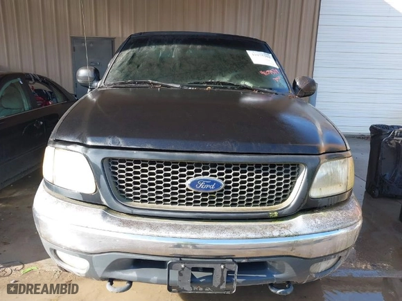 2000 Ford F-150 XL with VIN 1FTRX18LXYNA19385, listed as a IAAI auction lot 41075391 with 214,624 mi miles. Bid and sale history available at carsss.com. Image 6.