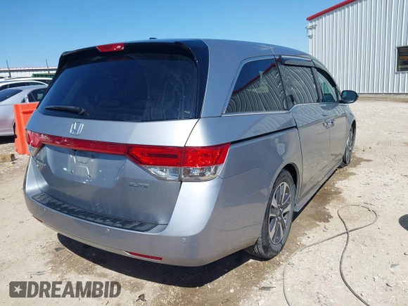 2016 Honda Odyssey Touring Elite with VIN 5FNRL5H96GB090653, listed as a IAAI auction lot 41720195 with 68,969 mi miles. Bid and sale history available at carsss.com. Image 4.