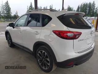 2016 Mazda CX-5 Grand Touring with VIN JM3KE2DYXG0675619, listed as a IAAI auction lot 42137144 with 106,262 mi miles and . Bid and sale history available at DreamBid. Image 3.