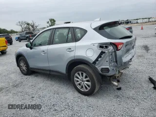 2016 Mazda CX-5 Sport with VIN JM3KE4BY1G0799275, listed as a Copart auction lot 51202355 with 98,409 mi miles and Non Repairable. Bid and sale history available at carsss.com. Image 2.