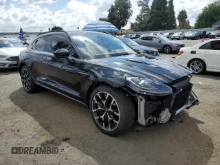 2021 Aston Martin DBX z VIN SCFVUJAW7MTV03341, wystawiony jako Copart lot #71015804 z przebiegiem 12 324 mil mil oraz Szkody całkowita. Historia ofert i sprzedaży dostępna na DreamBid. Obrazek 4.