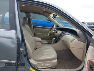 2004 Toyota Avalon XL with VIN 4T1BF28B84U370390, listed as a IAAI auction lot 41351151 with 242,910 mi miles and . Bid and sale history available at DreamBid. Image 5.