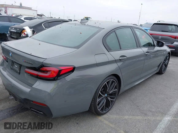 2022 BMW 5 Series M550i xDrive with VIN WBA13BK07NCL07995, listed as a IAAI auction lot 42454963 with 12,721 mi miles and . Bid and sale history available at DreamBid. Image 4.