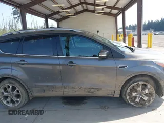 2014 Ford Escape Titanium with VIN 1FMCU9JX0EUC45801, listed as a IAAI auction lot 42121561 with 80,217 mi miles and . Bid and sale history available at DreamBid. Image 13.