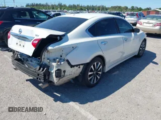 2016 Nissan Altima SV with VIN 1N4AL3AP9GC135114, listed as a IAAI auction lot 41851507 with 127,033 mi miles and . Bid and sale history available at DreamBid. Image 4.