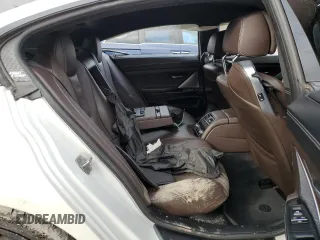 2015 BMW M6 z VIN WBS6C9C58FD467982, wystawiony jako Copart lot #78689983 z przebiegiem Nie podano mil oraz Szkody całkowita. Historia ofert i sprzedaży dostępna na DreamBid. Obrazek 11.