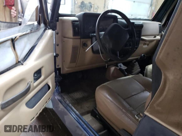 2000 Jeep Wrangler SE with VIN 1J4FA29P1YP739555, listed as a Copart auction lot 58501025 with 128,458 mi miles and Clean title. Bid and sale history available at DreamBid. Image 8.