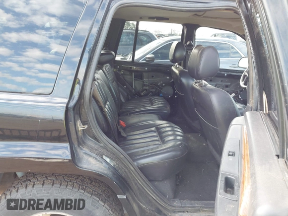 1999 Jeep Grand Cherokee Limited with VIN 1J4GW68NXXC637464, listed as a IAAI auction lot 41561690 with 235,728 mi miles. Bid and sale history available at carsss.com. Image 8.