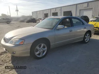 2001 Mazda Millenia z VIN JM1TA221911716600, wystawiony jako Copart lot #57639185 z przebiegiem 86 947 mil mil oraz Tytuł czysty. Historia ofert i sprzedaży dostępna na DreamBid. Obrazek 1.